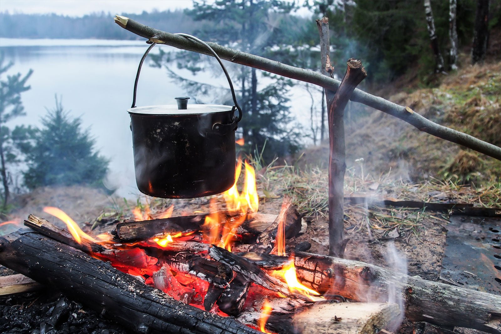 pot hanging over campfire