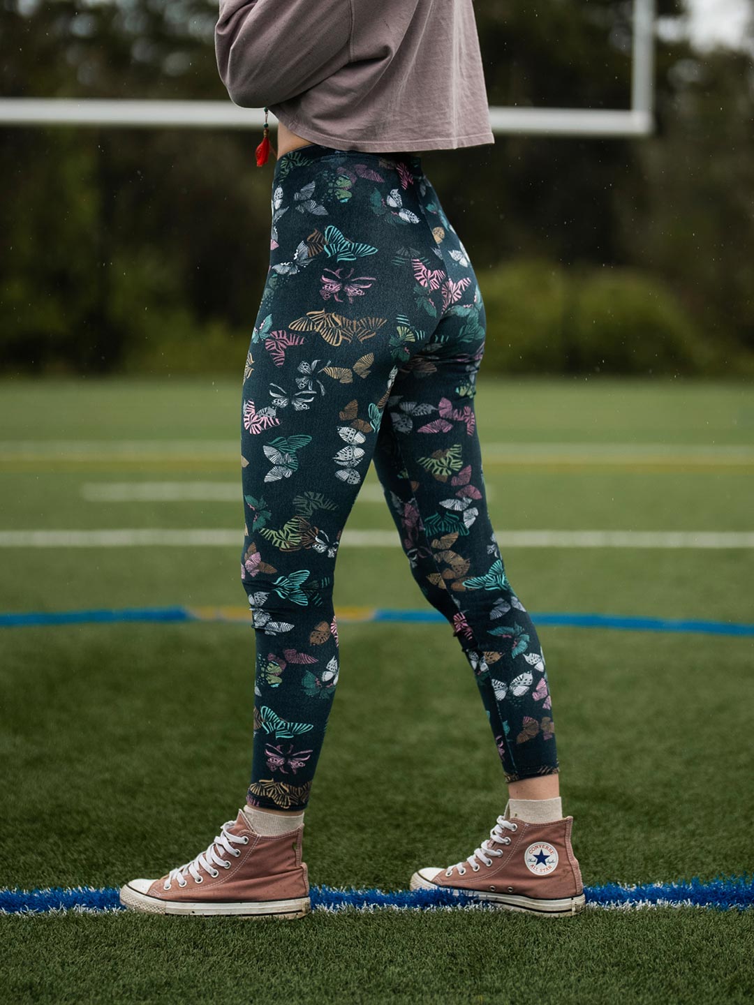 Woman wearing Butterfly Velvet SpiritHoods Leggings, side view