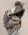 Girl in hooded Classic Silver Leopard Faux Fur Long Coat, leaning slightly, holding the coat closed at the chest, showcasing the lapels.