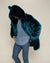 Dude slightly bending forward in a Royal Wolf Classic faux fur coat with the hood and ears on.