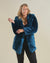 Sassy blonde curvy model wearing the Royal Wolf Classic Luxe faux fur jacket with the hood and ears down.