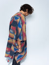 Man wearing Dire Wolf Fabric Poncho, side view 2