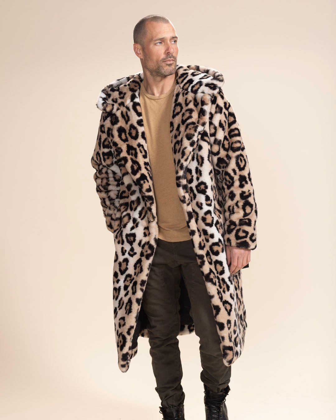 Smoldering gentleman model in the open Classic Men's Long Faux Fur Coat | Arabian Leopard, with hood and ears down. Sophisticated and bold.