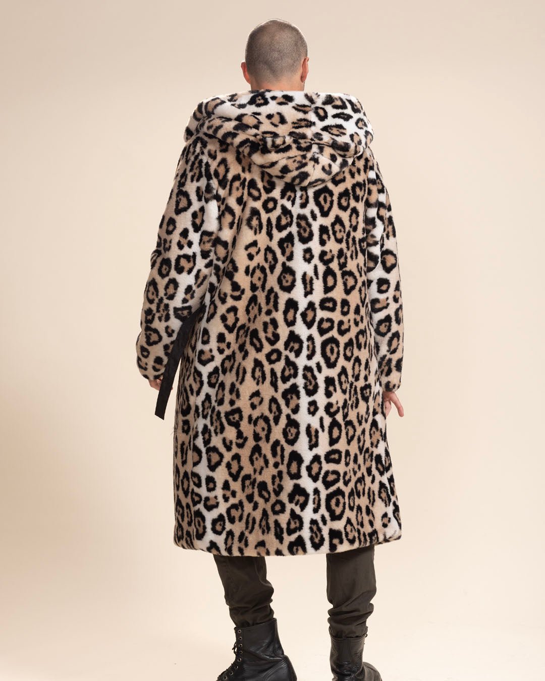 Shaved-head male model with back to camera in Classic Men's Long Vegan Fur Coat in Arabian Leopard Print, open with hood and ears down.