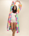 Pretty dark-haired model stretching with arms overhead in open Rainbow Bear Faux Fur Robe, hood and ears down. Cozy, relaxed style.