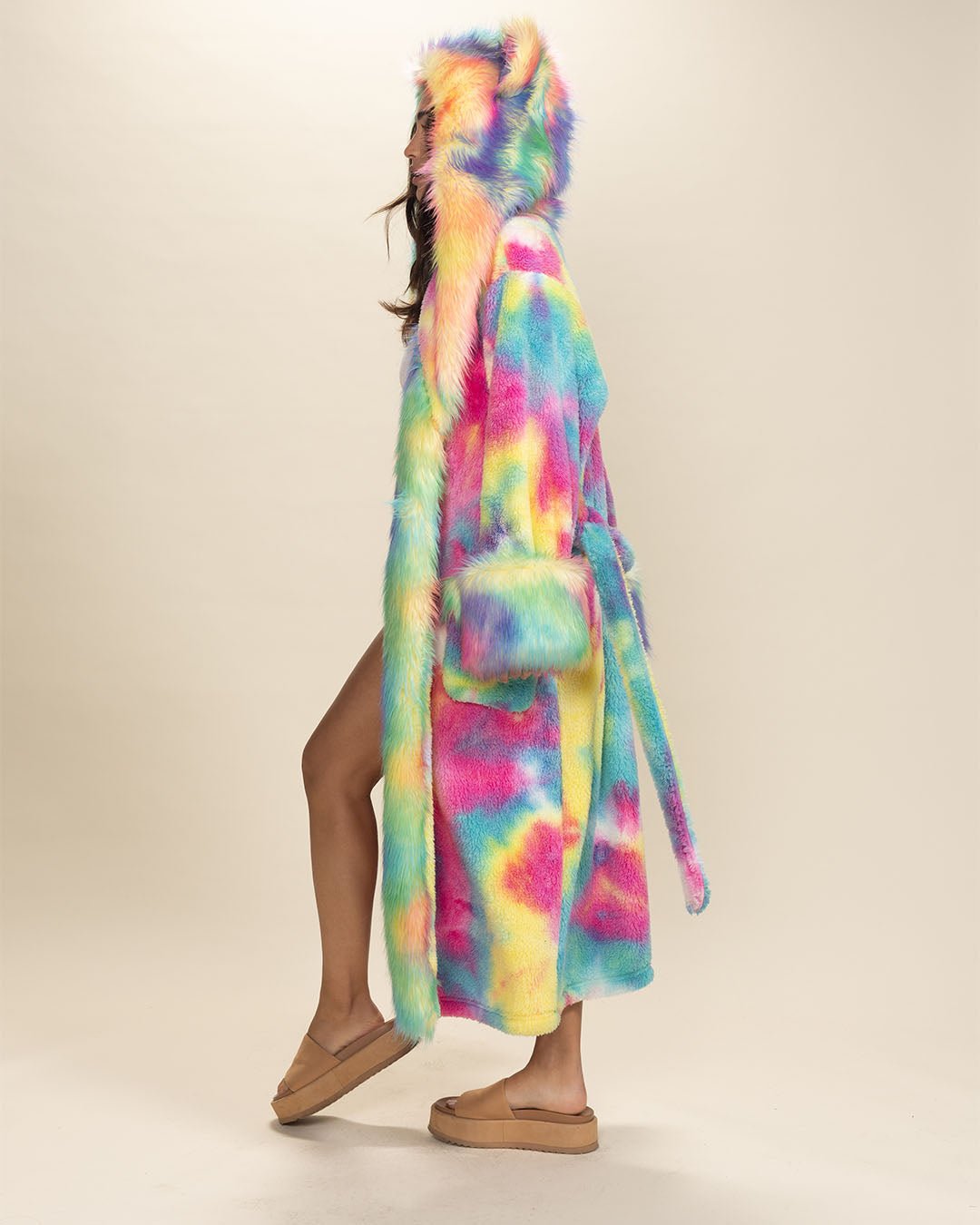 Gal in Rainbow Bear Faux Fur Robe, hood and ears up, facing sideways with a slightly bent knee, showcasing this colorful cozy robe.