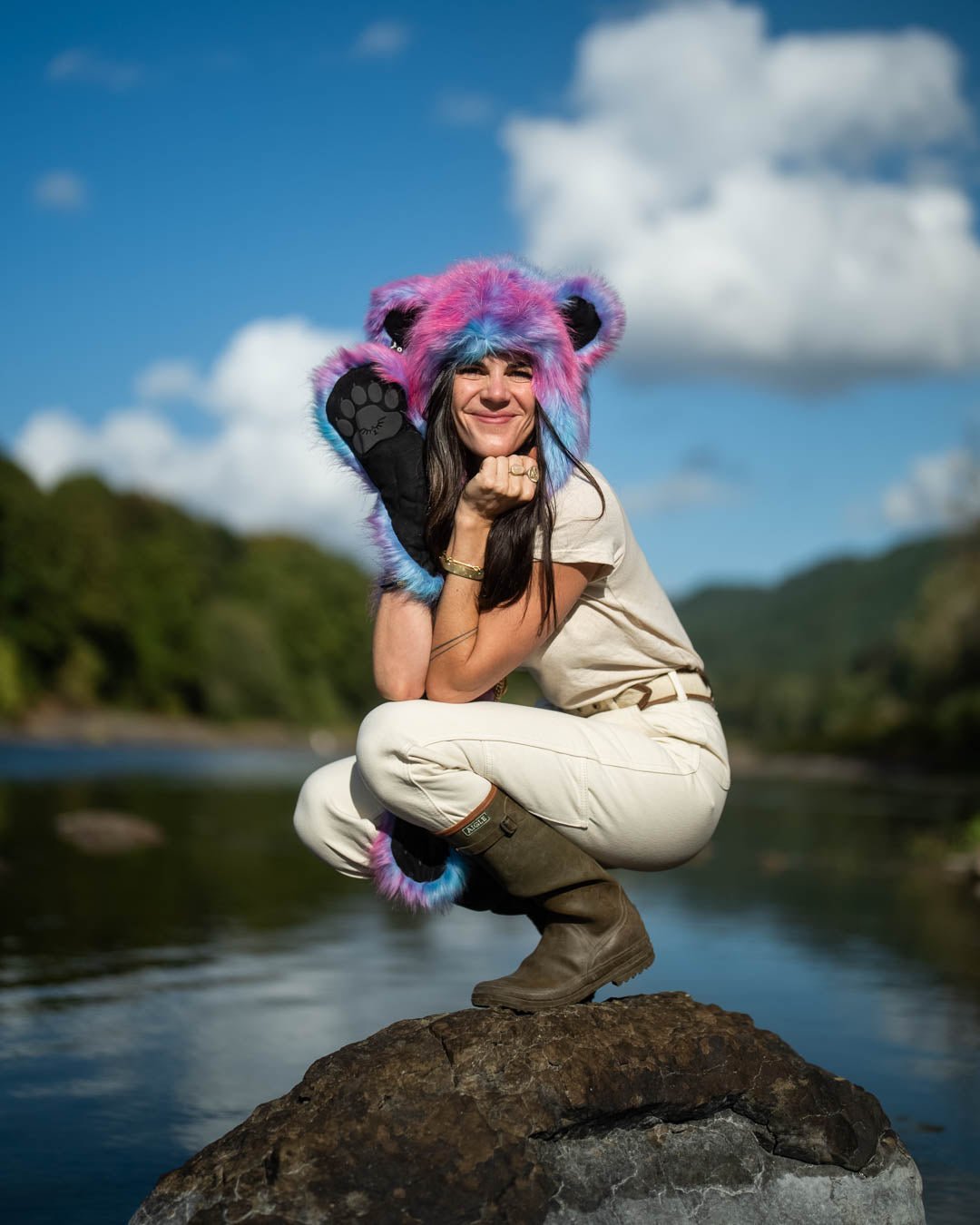 Woman wearing faux fur Collector Edition Cotton Candy Bear SpiritHood, side view 1