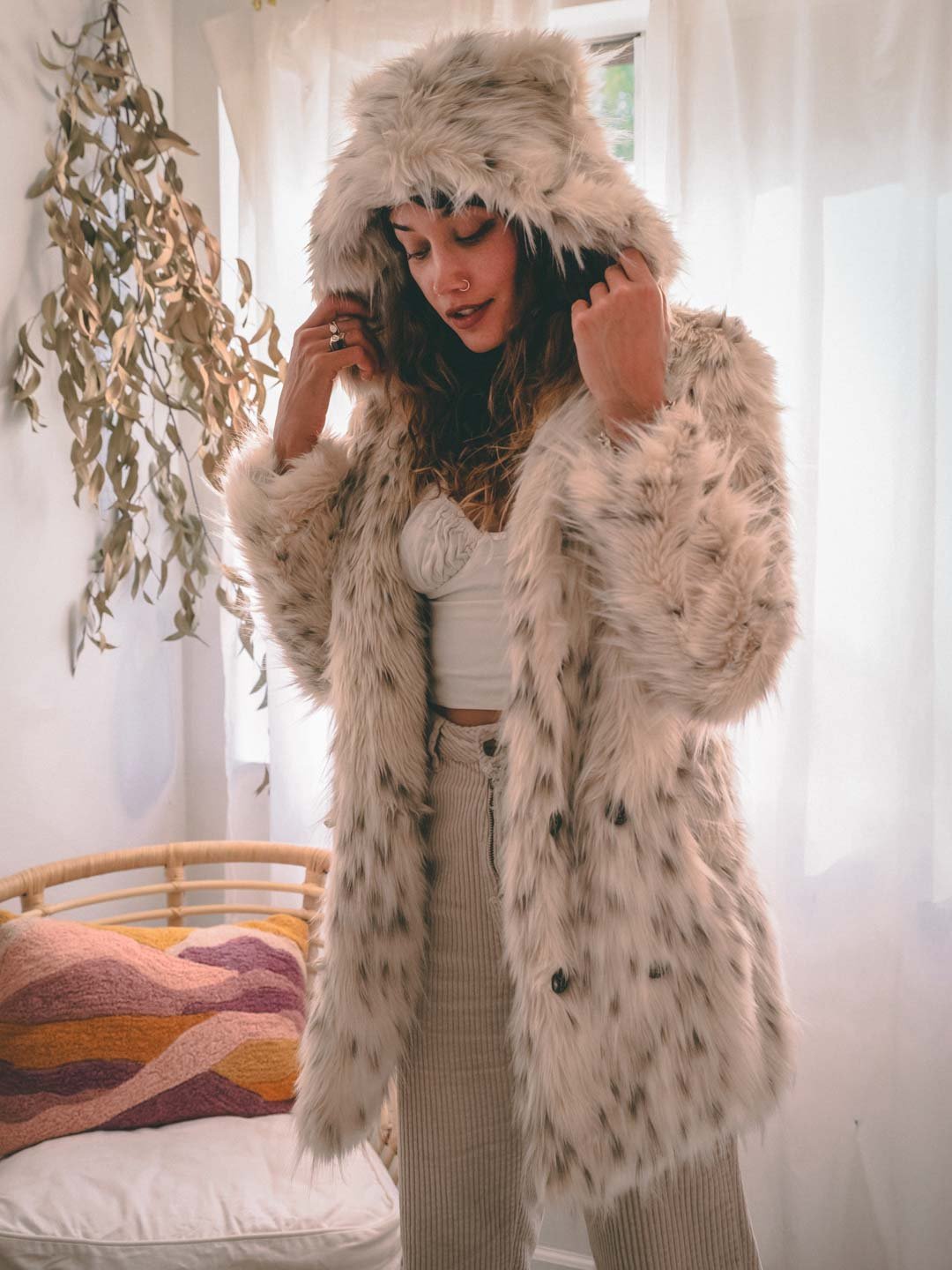 Woman wearing Classic Baby Snow Leopard Faux Fur Coat