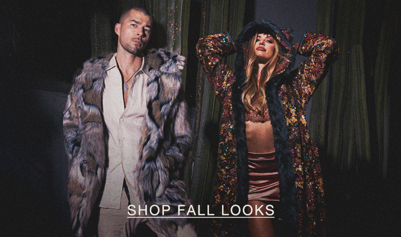 Man wearing a faux fur coat standing next to a woman wearing a sequin robe with SHOP FALL LOOKS linked 