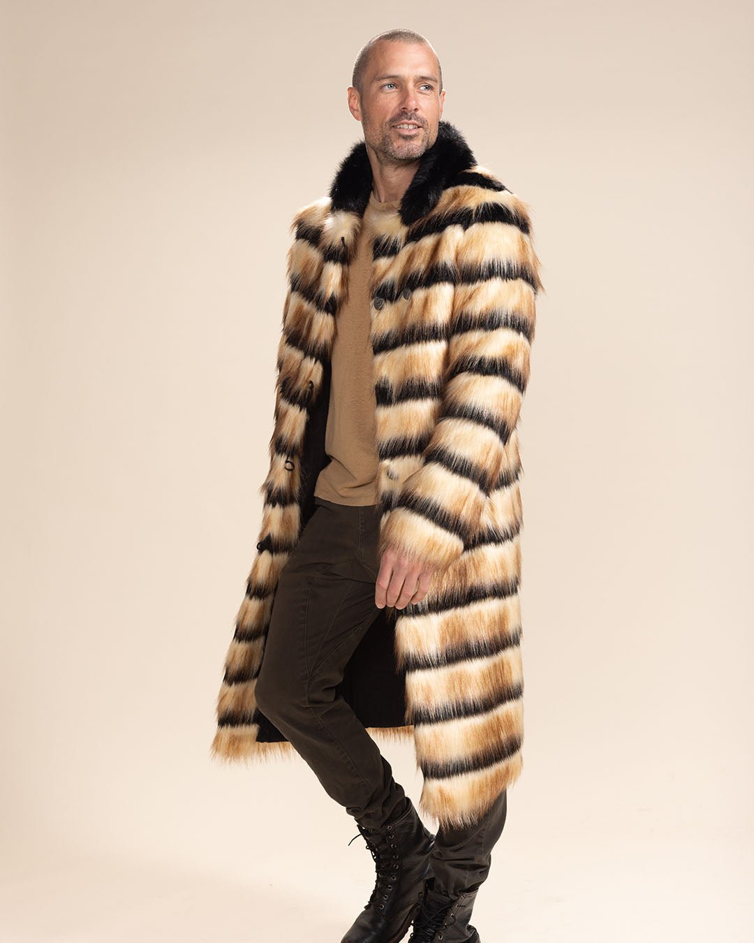 Semi-smiling handsome man wearing the Vegan Fur Collared Long Gazelle Coat. Stylish and modern.