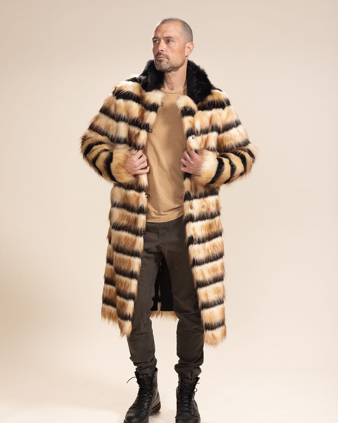 Man in Long Collared Gazelle Faux Fur Jacket, holding lapels and gazing into the distance. Sophisticated look.