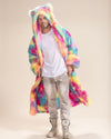 Flirtatious male model in Rainbow Bear Classic Faux Fur Robe, open with hood up, featuring playful bear ears. Cozy and bold.