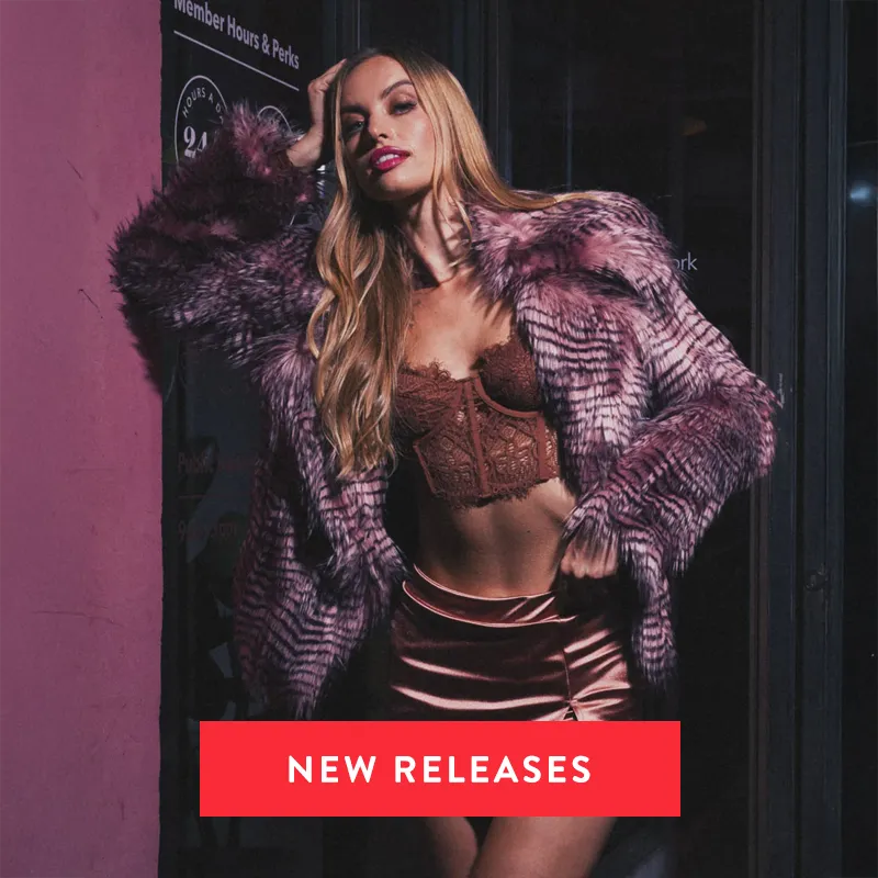 Blonde woman wearing a rose finch faux fur coat 