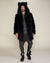 Fake fur Black Wolf Coat with hood and ears  worn by male model facing camera with buttons visible and hands to his sides.