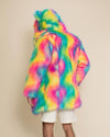 Man with his back turned to the camera, one arm bent, wearing the Rainbow Classic Bear Faux Fur Coat—bold and vibrant.