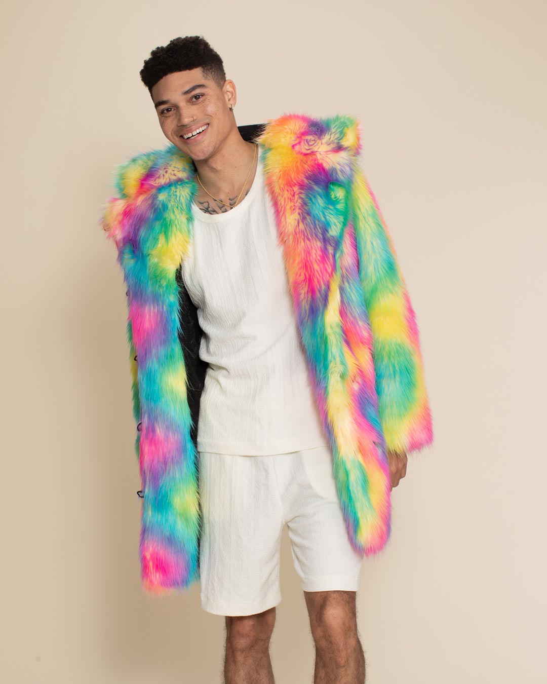 Smiling handsome guy leaning to one side wearing the Classic Rainbow Bear Faux Fur Jacket.