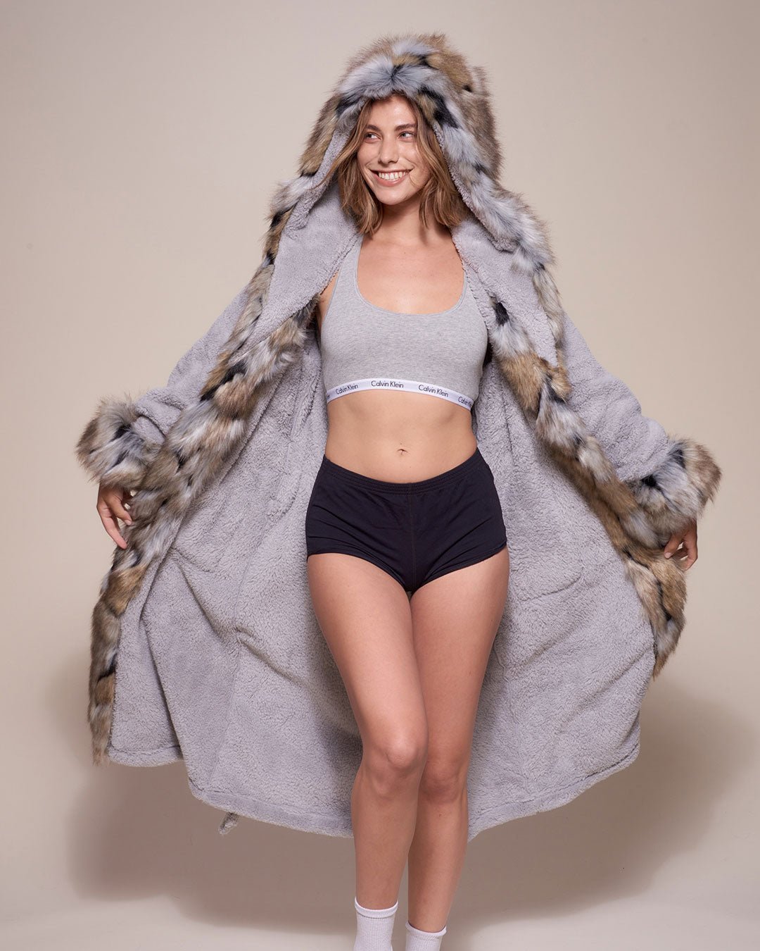 Exterior and Interior View of Hooded Wolverine Faux Fur Robe on Female