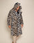 Male model looking down, wearing Classic Men's Long Faux Fur Coat in Arabian Leopard Print with hood and ears up. Bold, stylish look.