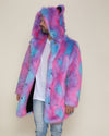 Male model with his head turned to the side, wearing the hood and ears up on his Cotton Candy Bear vegan fur coat.