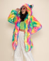 Pretty model in Rainbow Classic Faux Fur Coat, laughing with round orange sunglasses, facing to one side, hand on her hip.