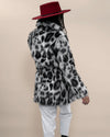 Girl in red fedora simulating a walk, back to camera, showcasing Collared Himalayan Snow Leopard Fake Fur Coat. Stylish faux fur look.