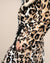 Close-up of waist cinched with belt on Classic Women's Long Faux Fur Coat in Arabian Leopard Print. Elegant, refined faux fur style.