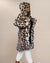 Girl facing sideways with hood and ears up, holding open Classic Women's Long Faux Fur Coat in Arabian Leopard Print. Chic, playful style.