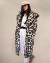 Chic, sassy woman in Classic Women's Long Faux Fur Coat in Arabian Leopard Print, open with hands in pockets, dark hair, sunglasses, beige beret.