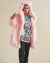 Male model in Flamingo Wolf Classic faux fur jacket with hood and ears, looking away, one hand outstretched.