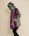 Man facing sideways with hands in pockets of Disco Cat Leopard Classic fake fur coat, hood and ears up. Cozy, playful outerwear.