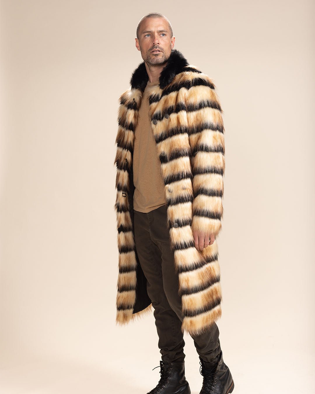 Handsome man gazing into the distance thoughtfully, wearing the Long Gazelle Faux Fur Coat. Sophisticated look.