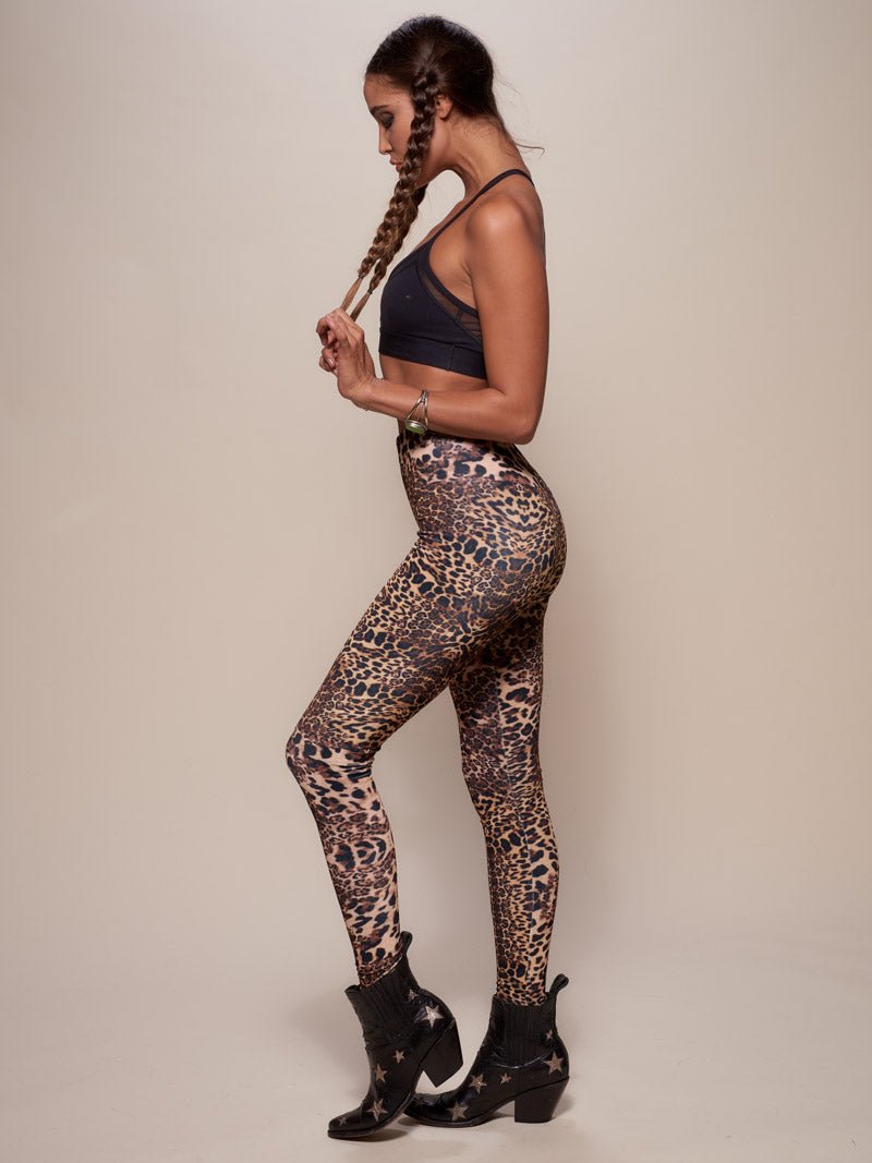 Woman wearing Amur Leopard Velvet Leggings