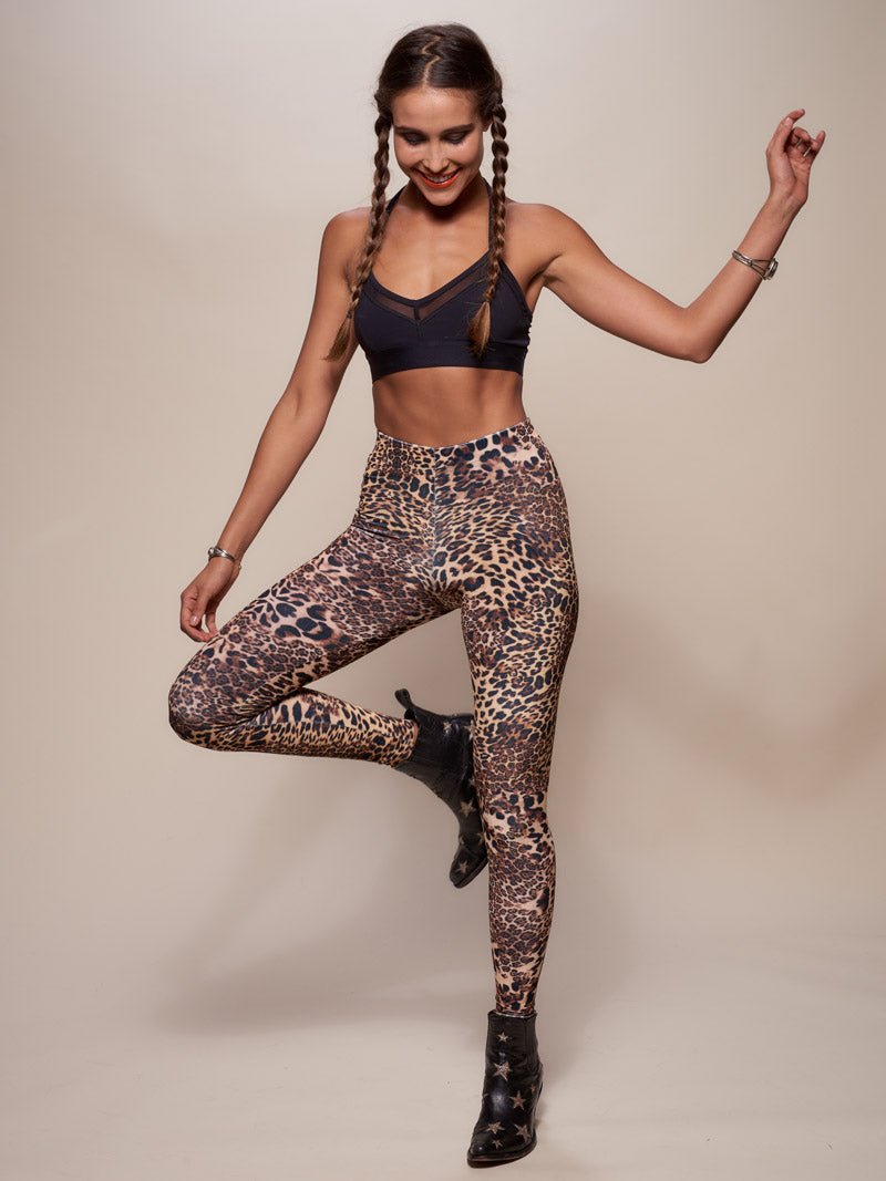 Woman wearing Amur Leopard Velvet Leggings, front view