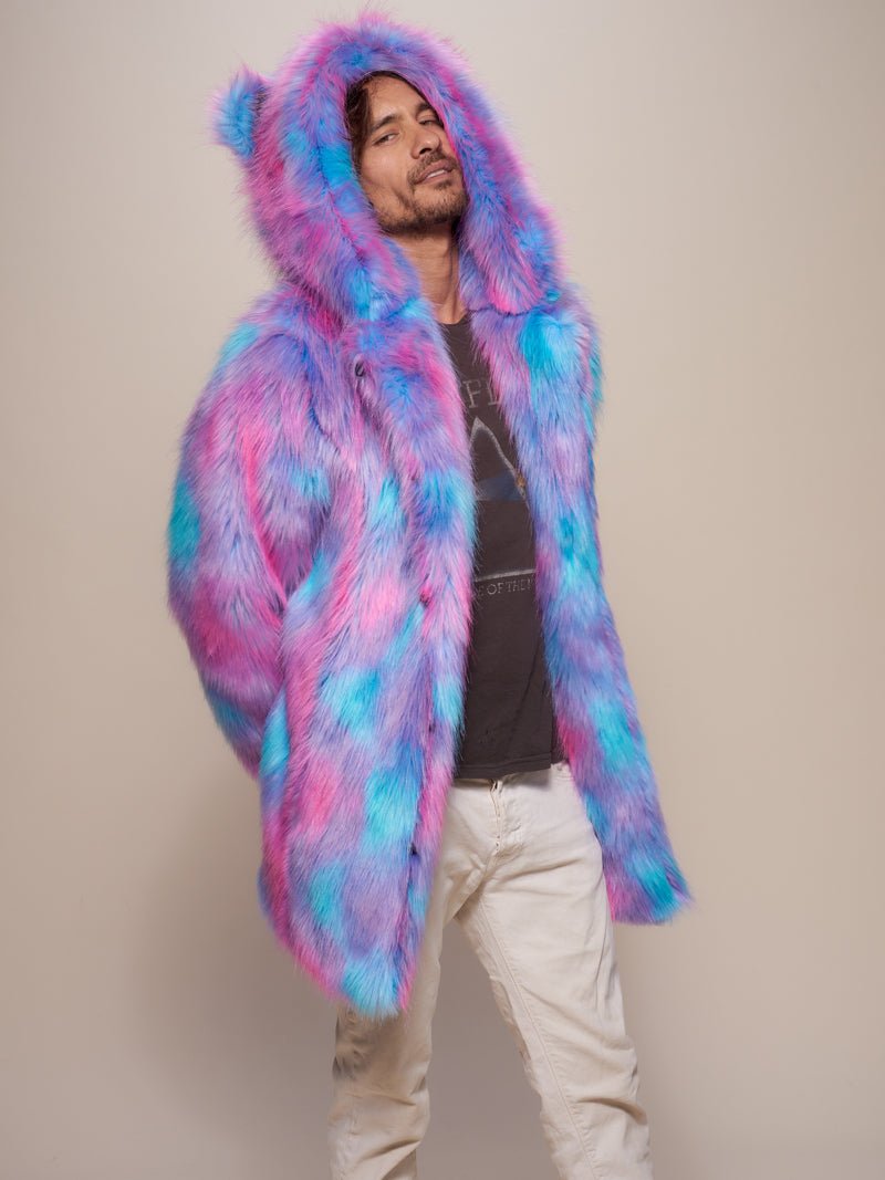 Sly male model with a tilted head and arms behind his back, wearing the Cotton Candy Bear Faux Fur Coat.