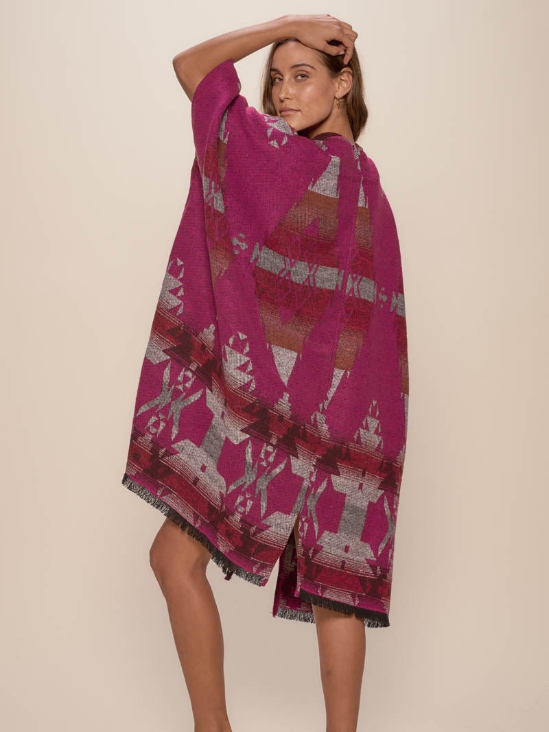 Woman wearing Grey Fox Fabric Poncho, back view