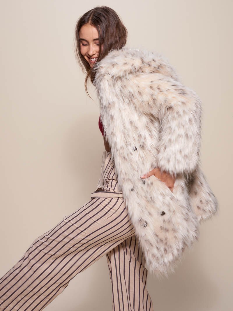 Woman wearing Classic Baby Snow Leopard Faux Fur Coat, side view 2