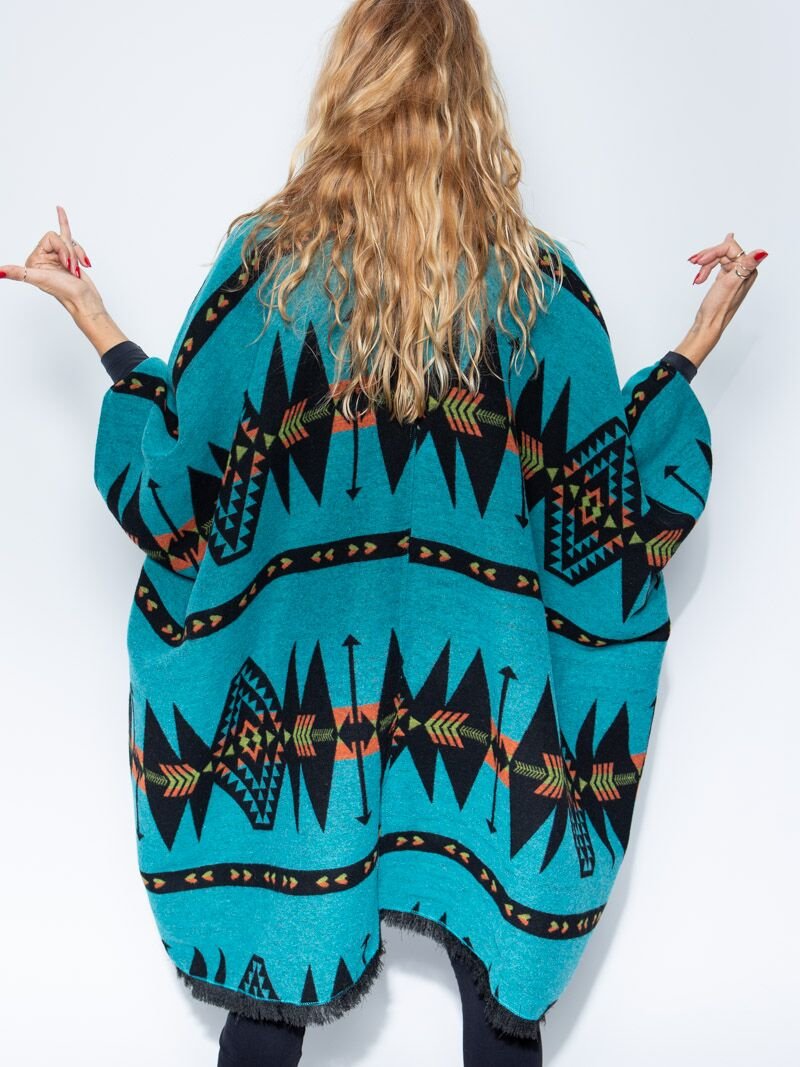 Woman wearing Grey Wolf Fabric Poncho, back view 1