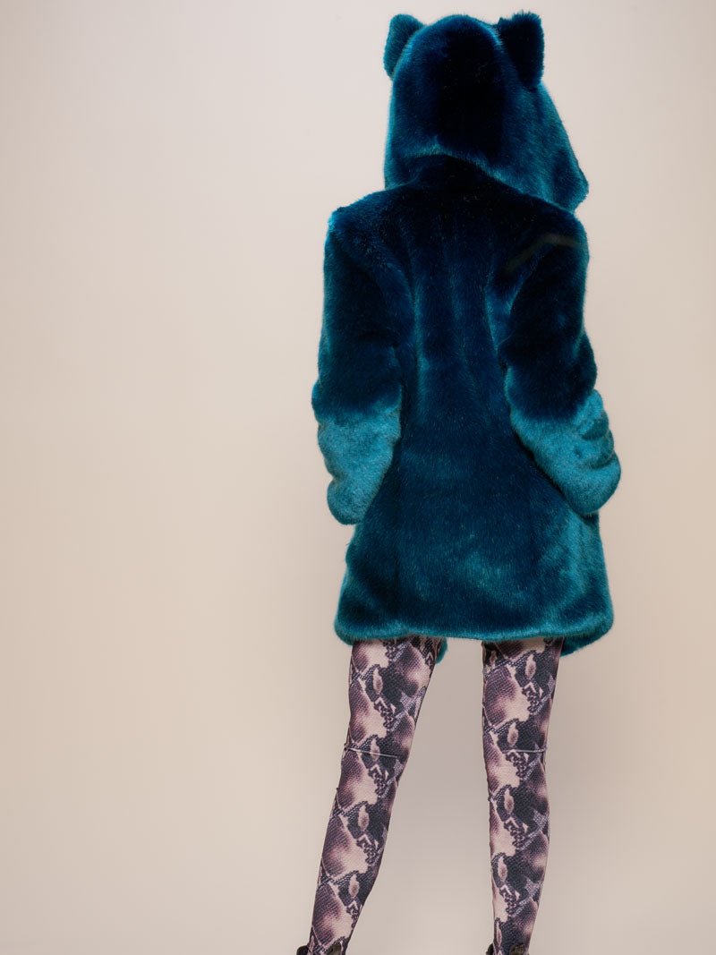 Female model with the hood and ears up on the Classic Royal Wolf Luxe faux fur coat, facing her back to the camera.