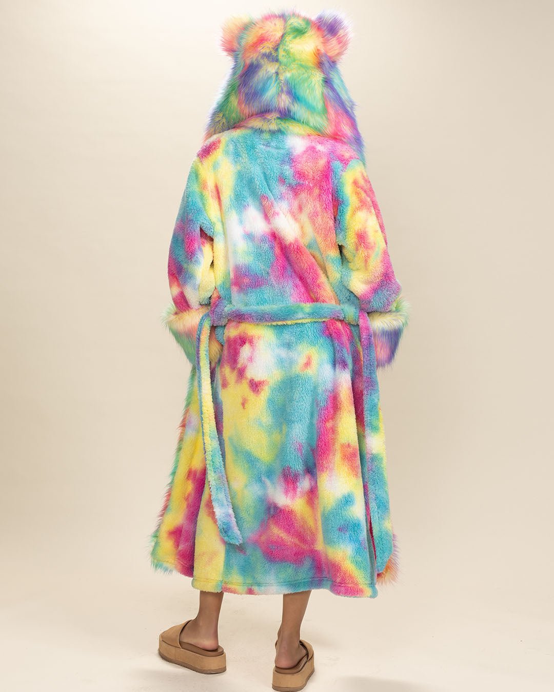 Total back view of a gal in Rainbow Bear Faux Fur Robe, belt undone, hood and ears up. Cozy and playful style from behind.