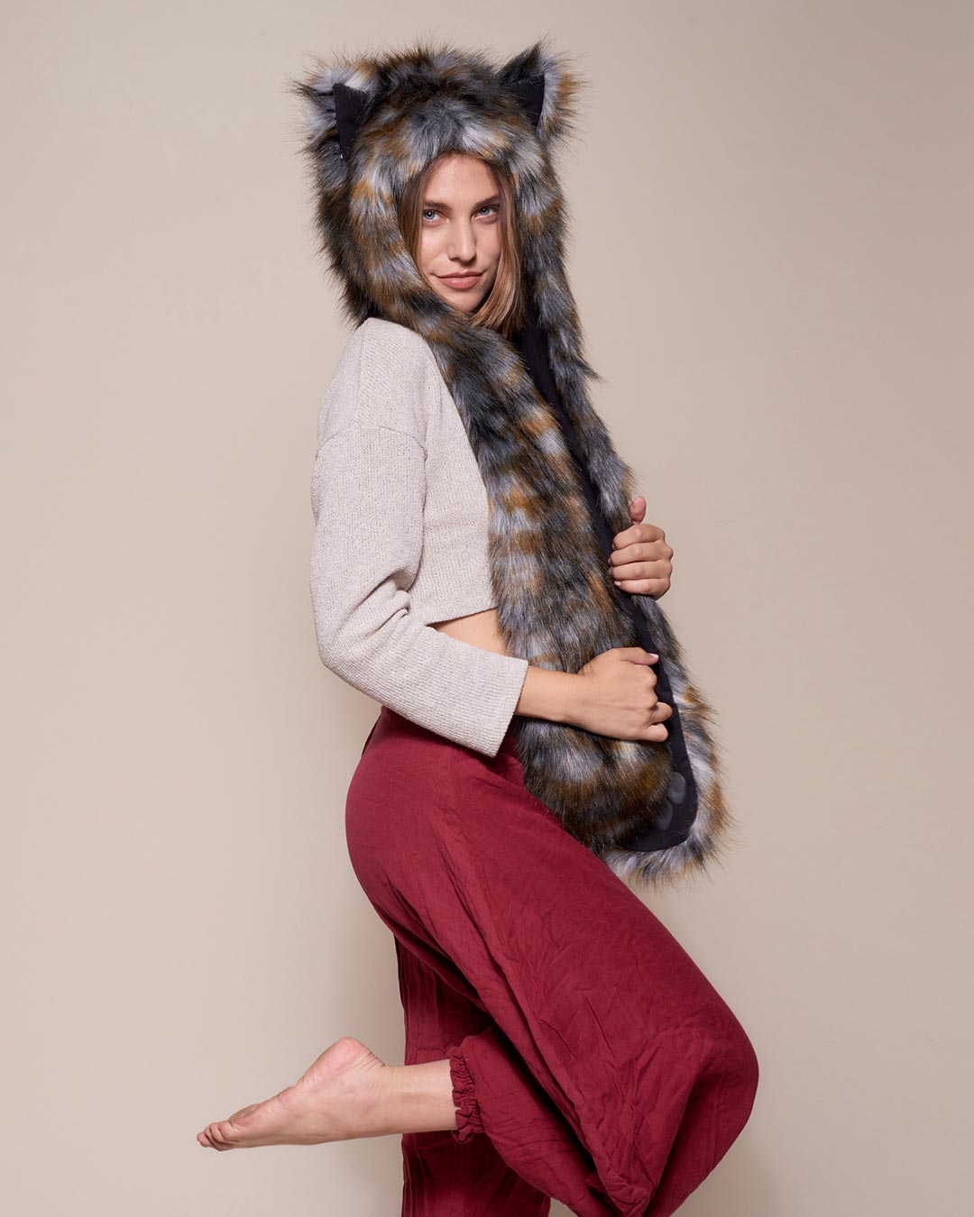 Woman wearing Brindle Wolf Collector Edition Faux Fur Hood, side view