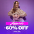 Man and woman wearing furry sweatshirts in front of a purple wall with text that says Apparel up to 60% Off Shop Now