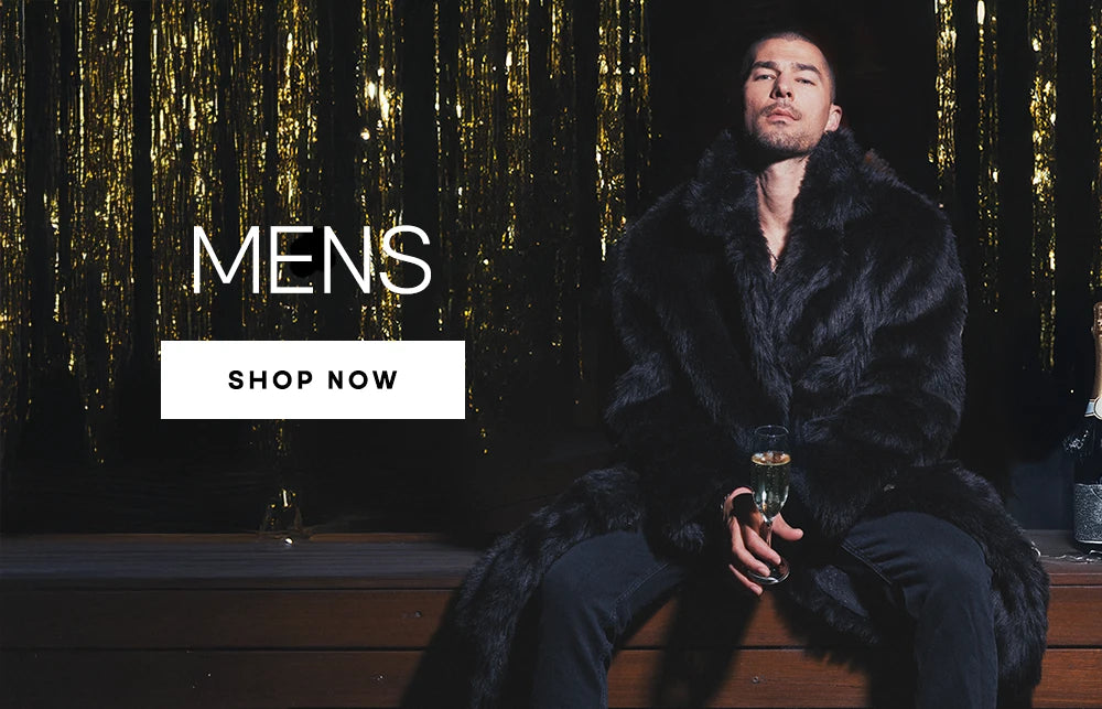 Man wearing a full-length black faux fur coat, holding a champagne glass.