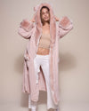 Woman wearing Rose Quartz Wolf Luxe Classic Faux Fur Robe, front view 4