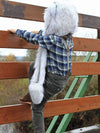 Boy Climbing Fence Wearing Kids Faux Fur SpiritHood in Husky Design